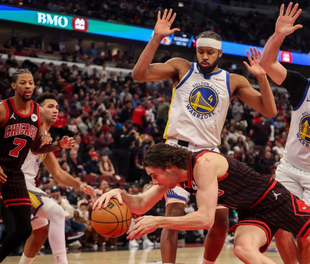 Chicago Bulls guard Josh Giddey (3) falls in the third quarter during a game against the Golden State Warriors, Sunday, Dec. 7, 2025, at the United Center in Chicago. (Dominic Di Palermo/Chicago Tribune)