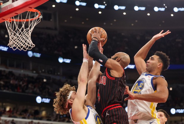 Chicago Bulls guard Jevon Carter (5) goes up for a layup in the third quarter during a game against the Golden State Warriors, Sunday, Dec. 7, 2025, at the United Center in Chicago. (Dominic Di Palermo/Chicago Tribune)