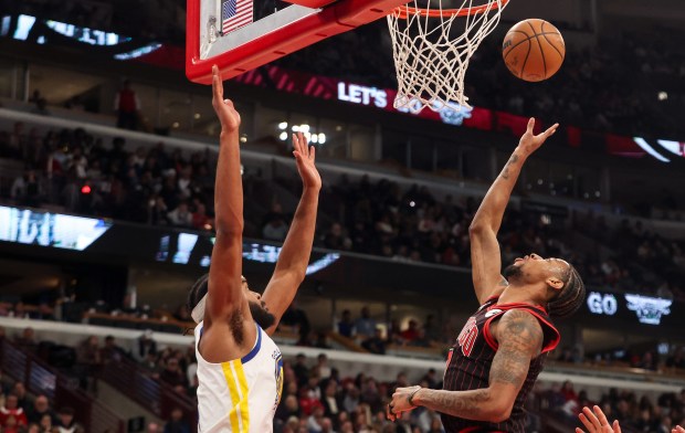 Chicago Bulls forward Dalen Terry (7) makes a layup in the third quarter during a game against the Golden State Warriors, Sunday, Dec. 7, 2025, at the United Center in Chicago. (Dominic Di Palermo/Chicago Tribune)