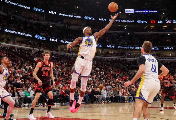 Golden State Warriors forward Jimmy Butler III (10) grabs a rebound in the fourth quarter during a game against the Chicago Bulls, Sunday, Dec. 7, 2025, at the United Center in Chicago. (Dominic Di Palermo/Chicago Tribune)