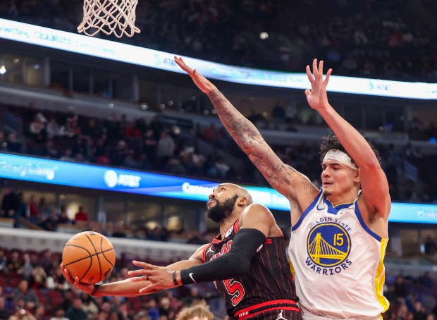 Chicago Bulls guard Jevon Carter (5) goes up for a layup in the fourth quarter during a game against the Golden State Warriors, Sunday, Dec. 7, 2025, at the United Center in Chicago. (Dominic Di Palermo/Chicago Tribune)