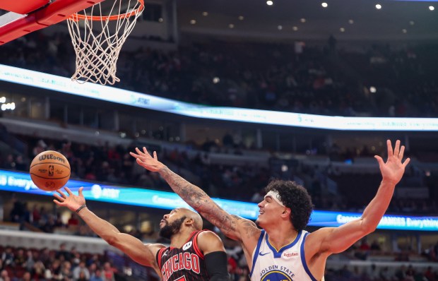 Chicago Bulls guard Jevon Carter (5) goes up for a layup in the fourth quarter during a game against the Golden State Warriors, Sunday, Dec. 7, 2025, at the United Center in Chicago. (Dominic Di Palermo/Chicago Tribune)