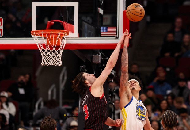 Chicago Bulls guard Josh Giddey (3) goes up for a layup against Golden State Warriors forward Gui Santos (15) in the third quarter, Sunday, Dec. 7, 2025, at the United Center in Chicago. (Dominic Di Palermo/Chicago Tribune)