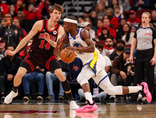 Golden State Warriors forward Jimmy Butler III (10) drives the lane in the fourth quarter during a game against the Chicago Bulls, Sunday, Dec. 7, 2025, at the United Center in Chicago. (Dominic Di Palermo/Chicago Tribune)