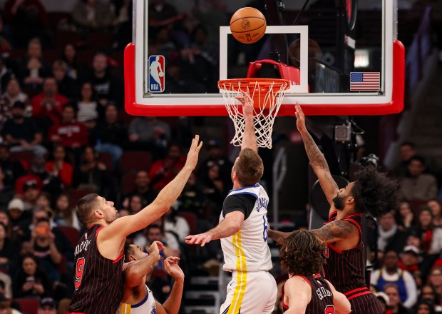 Golden State Warriors guard Pat Spencer (61) makes a layup in the fourth quarter during a game against the Chicago Bulls, Sunday, Dec. 7, 2025, at the United Center in Chicago. (Dominic Di Palermo/Chicago Tribune)
