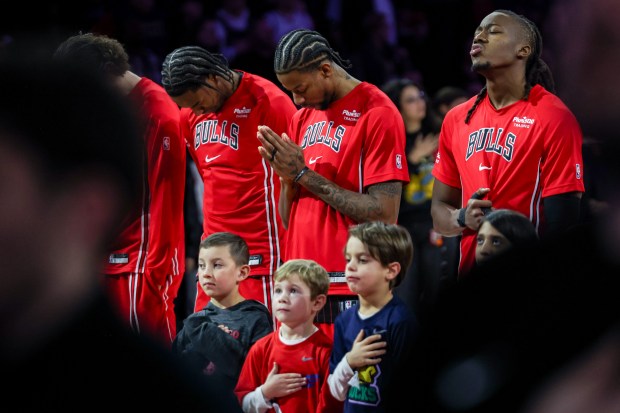 The Chicago bulls stand for the National Anthem before a game against the Golden State Warriors, Sunday, Dec. 7, 2025, at the United Center in Chicago. (Dominic Di Palermo/Chicago Tribune)