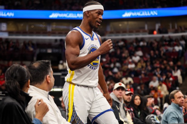 Golden State Warriors forward Jimmy Butler III (10) leaves the crowd after falling into it in the second quarter during a game against the Chicago Bulls, Sunday, Dec. 7, 2025, at the United Center in Chicago. (Dominic Di Palermo/Chicago Tribune)