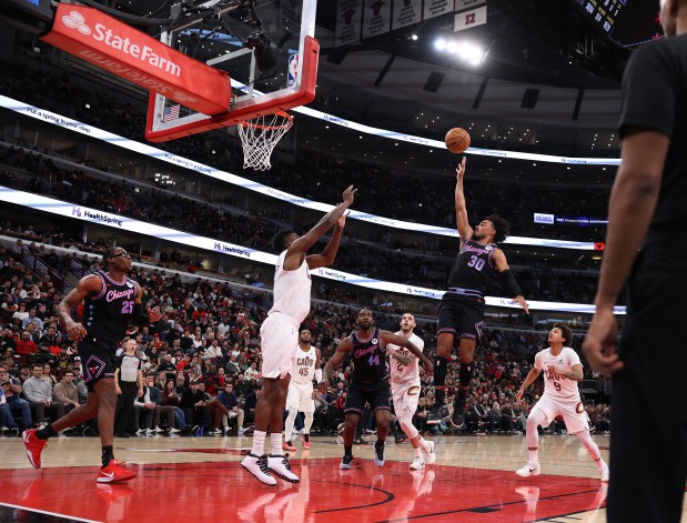 Chicago Bulls guard Tre Jones (30) puts up a shot in the second half of a game against the Cleveland Cavaliers at the United Center in Chicago on Dec. 17, 2025. (Chris Sweda/Chicago Tribune)
