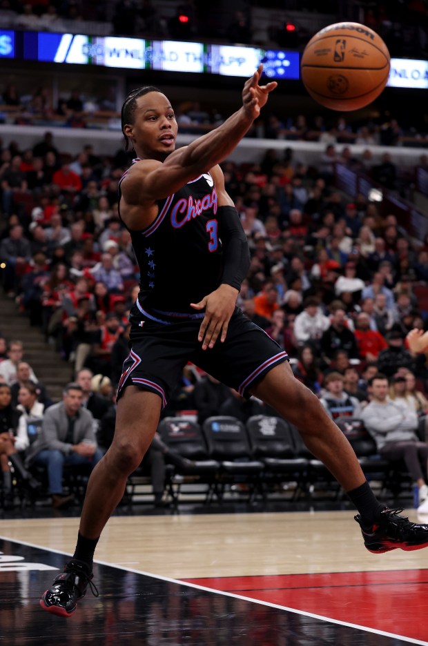 Chicago Bulls forward/guard Isaac Okoro (35) saves the ball from going out of bounds in the second half of a game against the Cleveland Cavaliers at the United Center in Chicago on Dec. 17, 2025. (Chris Sweda/Chicago Tribune)