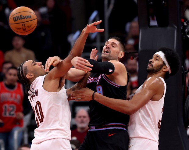 Chicago Bulls center Nikola Vučević (9) passes out to a teammate in the second half of a game against the Cleveland Cavaliers at the United Center in Chicago on Dec. 17, 2025. (Chris Sweda/Chicago Tribune)