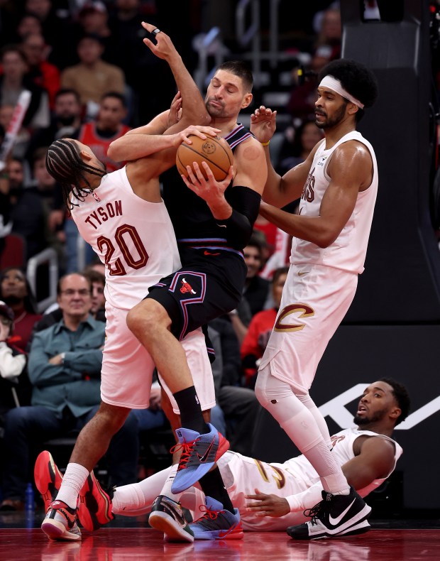 Chicago Bulls center Nikola Vučević (9) pulls down a rebound in the second half of a game against the Cleveland Cavaliers at the United Center in Chicago on Dec. 17, 2025. (Chris Sweda/Chicago Tribune)