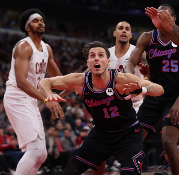Chicago Bulls forward/center Zach Collins (12) looks to grab a rebound in the first half of a game against the Cleveland Cavaliers at the United Center in Chicago on Dec. 17, 2025. (Chris Sweda/Chicago Tribune)