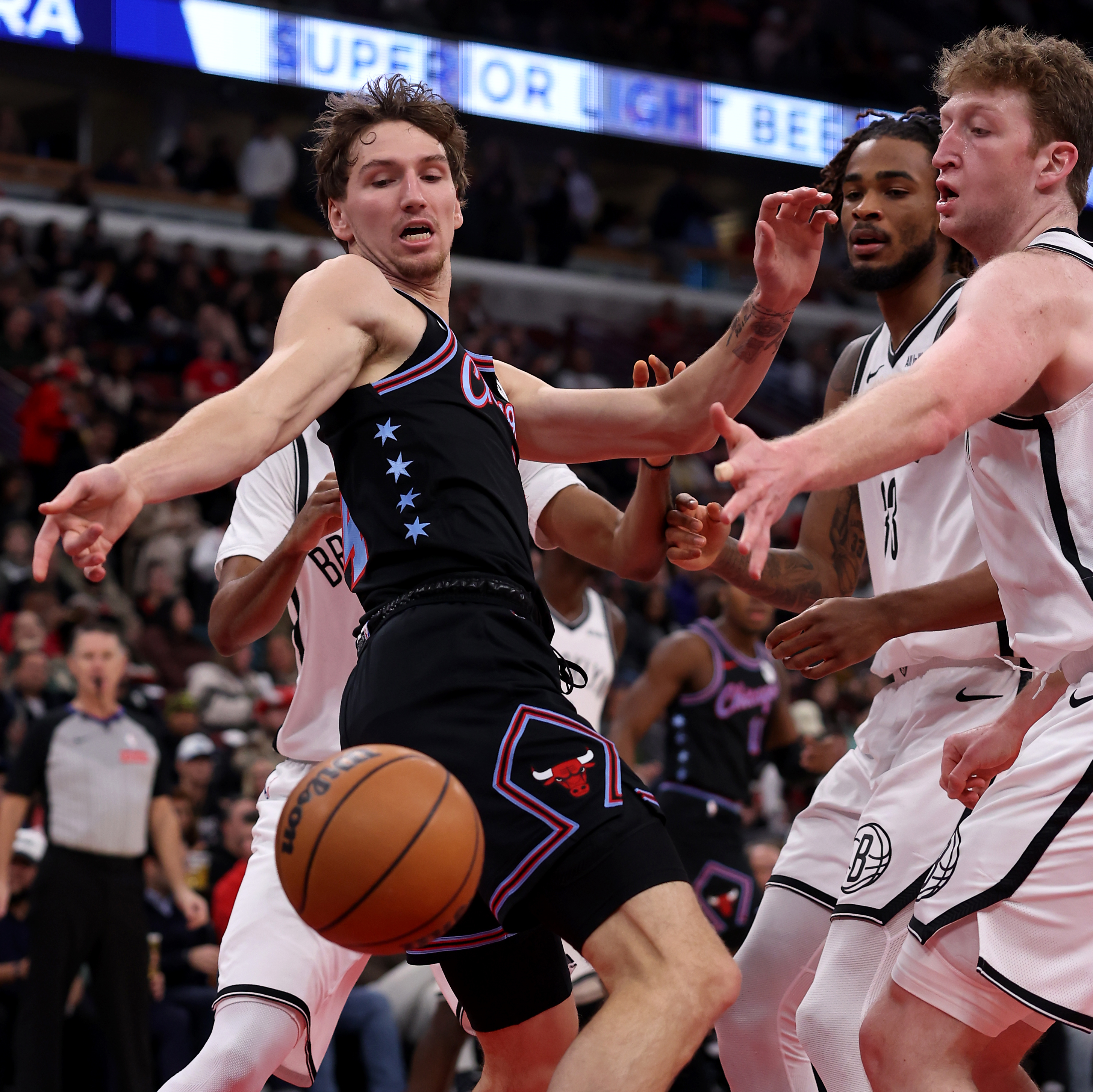 Chicago Bulls forward Matas Buzelis (14) reacts to a loose ball in the first half of a game against the Brooklyn Nets at the United Center in Chicago on Dec. 3, 2025. (Chris Sweda/Chicago Tribune)