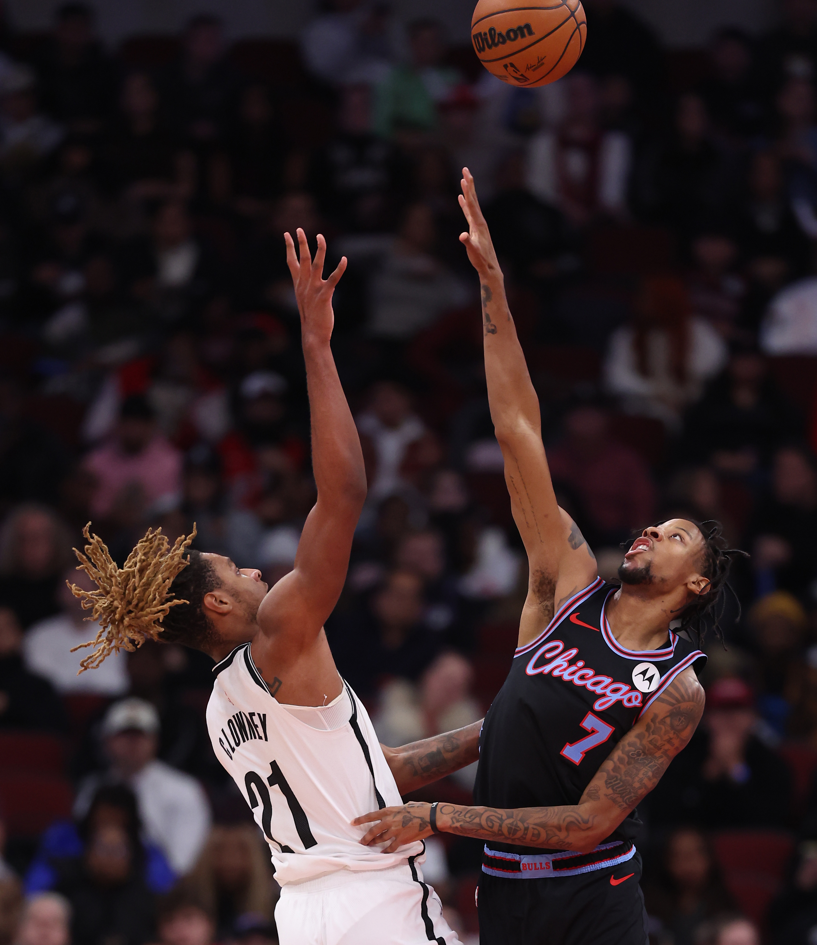 Brooklyn Nets forward/center Noah Clowney (21) shoots over Chicago Bulls forward Dalen Terry (7) in the first half of a game at the United Center in Chicago on Dec. 3, 2025. (Chris Sweda/Chicago Tribune)