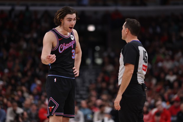 Chicago Bulls guard Josh Giddey (3) agrees with a referee after a technical foul was called on Giddey in the first half of a game against the Brooklyn Nets at the United Center in Chicago on Dec. 3, 2025. (Chris Sweda/Chicago Tribune)