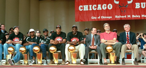 The Bulls celebrate their sixth NBA title during a rally in Grant Park on June 16, 1998. Seated from left; Toni Kukoč, Ron Harper, Dennis Rodman, Scottie Pippen, Michael Jordan, Mayor Richard M. Daley, coach Phil Jackson and Gov. Jim Edgar. (Chuck Berman/Chicago Tribune)