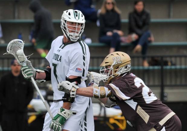 Baltimore, MD-4/29/18 - Loyola #7 Pat Spencer withstands pressure from Lehigh #22 Ian Strain near the end of the game. Loyola beat Lehigh, 15-8, to win the Patriot League Championship. Amy Davis/ Baltimore Sun Staff Photographer - #4069