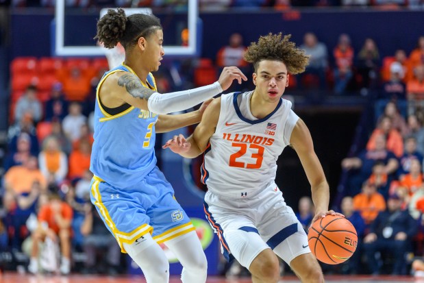 Illinois guard Keaton Wagler drives against Southern University's Cam Amboree during the first half of an NCAA college basketball game Monday, Dec. 29, 2025, in Champaign, Ill. (AP Photo/Craig Pessman)