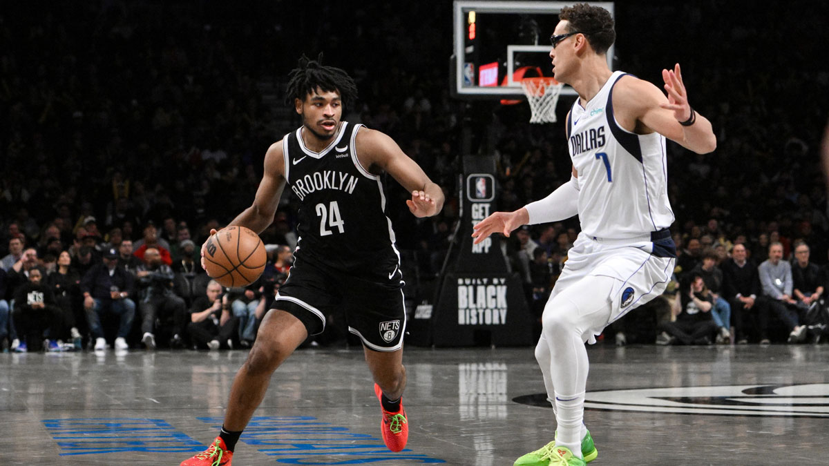 Brooklyn Nets guard Cam Thomas (24) drives to the basket as Dallas Mavericks center Dwight Powell (7) defends during the third quarter at Barclays Center.