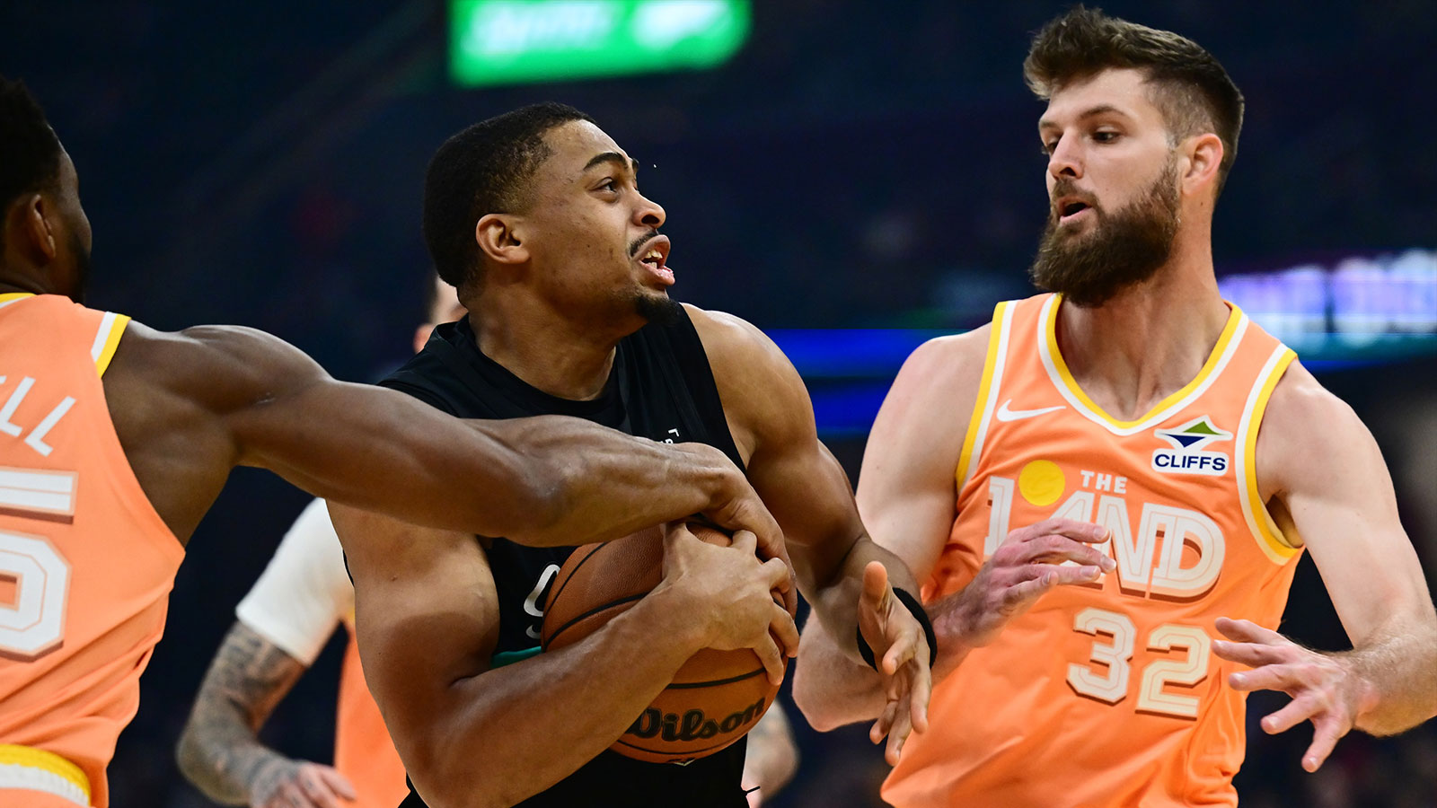 San Antonio Spurs forward Keldon Johnson (3) drives to the basket against Cleveland Cavaliers forward Dean Wade (32) during the first half at Rocket Arena.