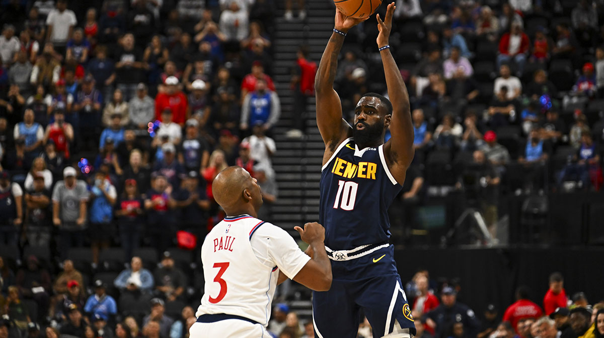 Denver Nuggets guard/forward Tim Hardaway Jr. (10) shoots against Los Angeles Clippers guard Chris Paul (3) during the third quarter at Intuit Dome. 