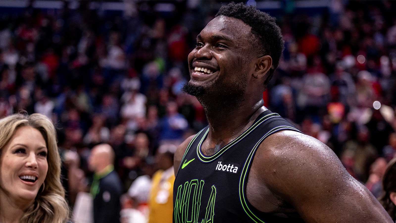 New Orleans Pelicans forward Zion Williamson (1) is interviewed by the media after the game at Smoothie King Center.