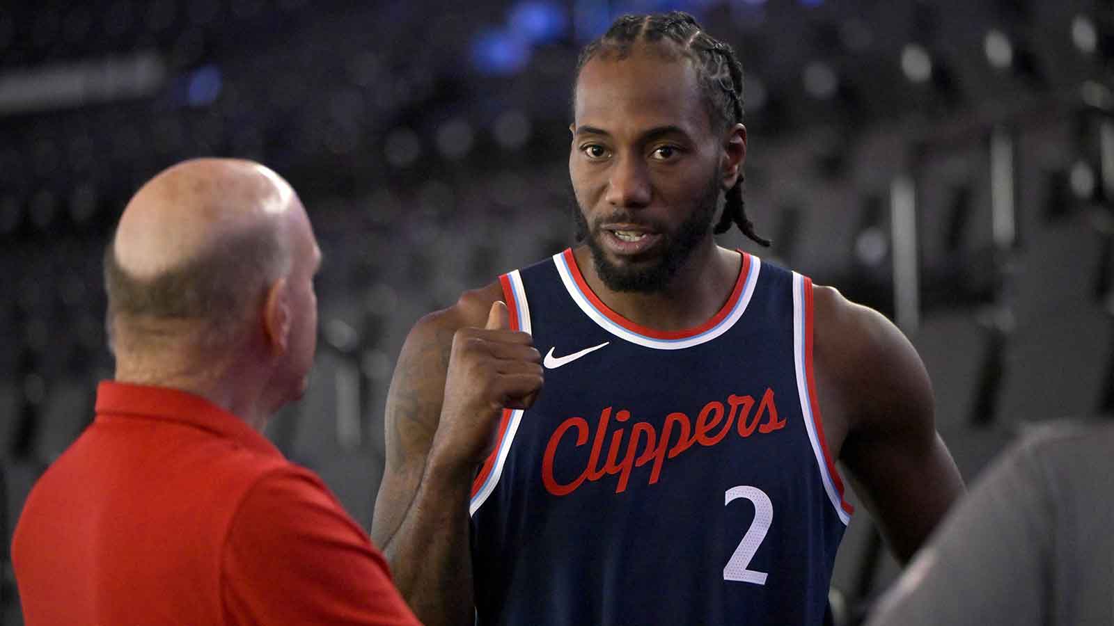 Clippers forward Kawhi Leonard (2) talks with team owner Steve Ballmer during media day at Intuit Dome
