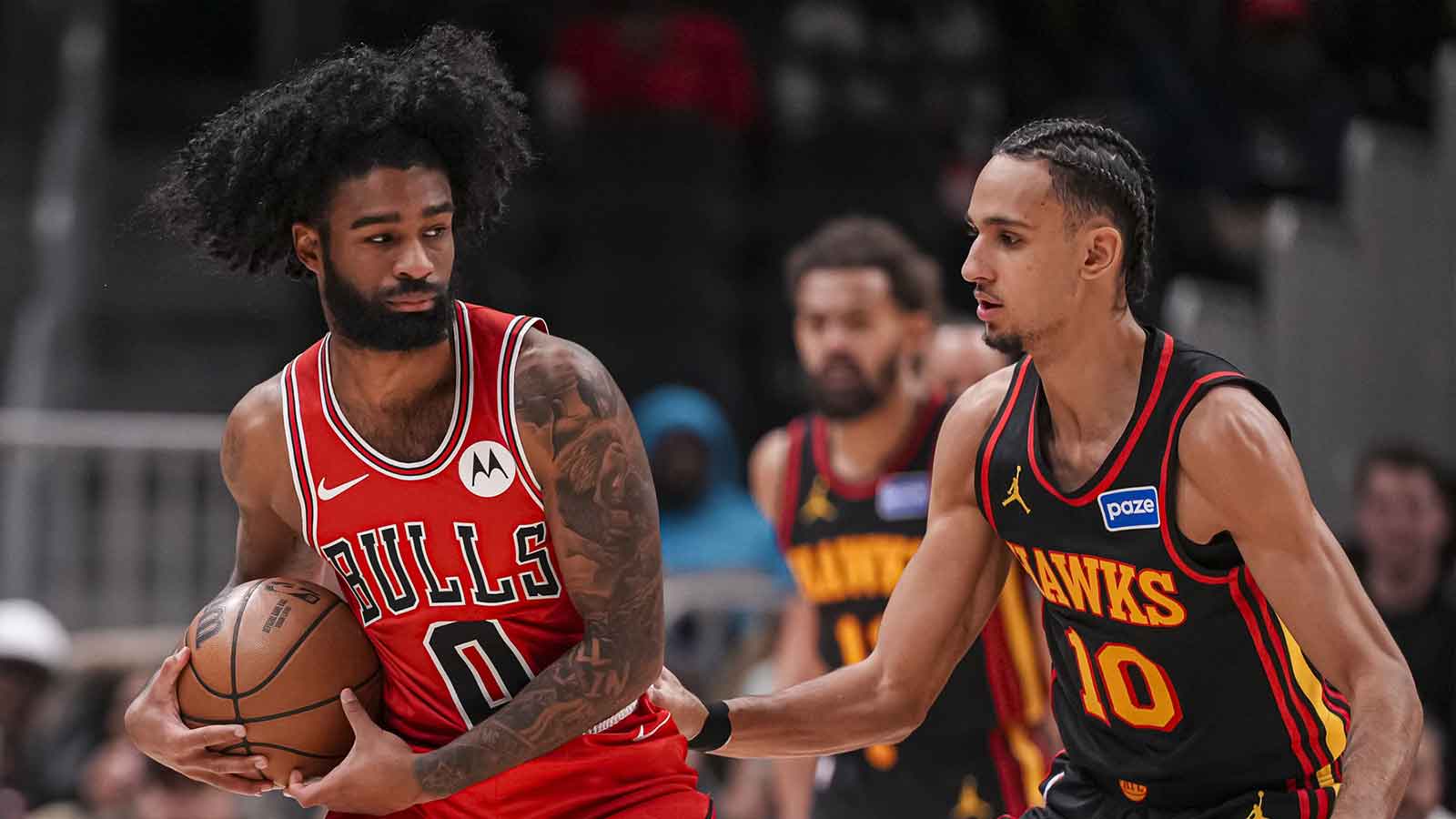 Chicago Bulls guard Coby White (0) controls the ball against Atlanta Hawks forward Zaccharie Risacher (10) during the first half at State Farm Arena. 