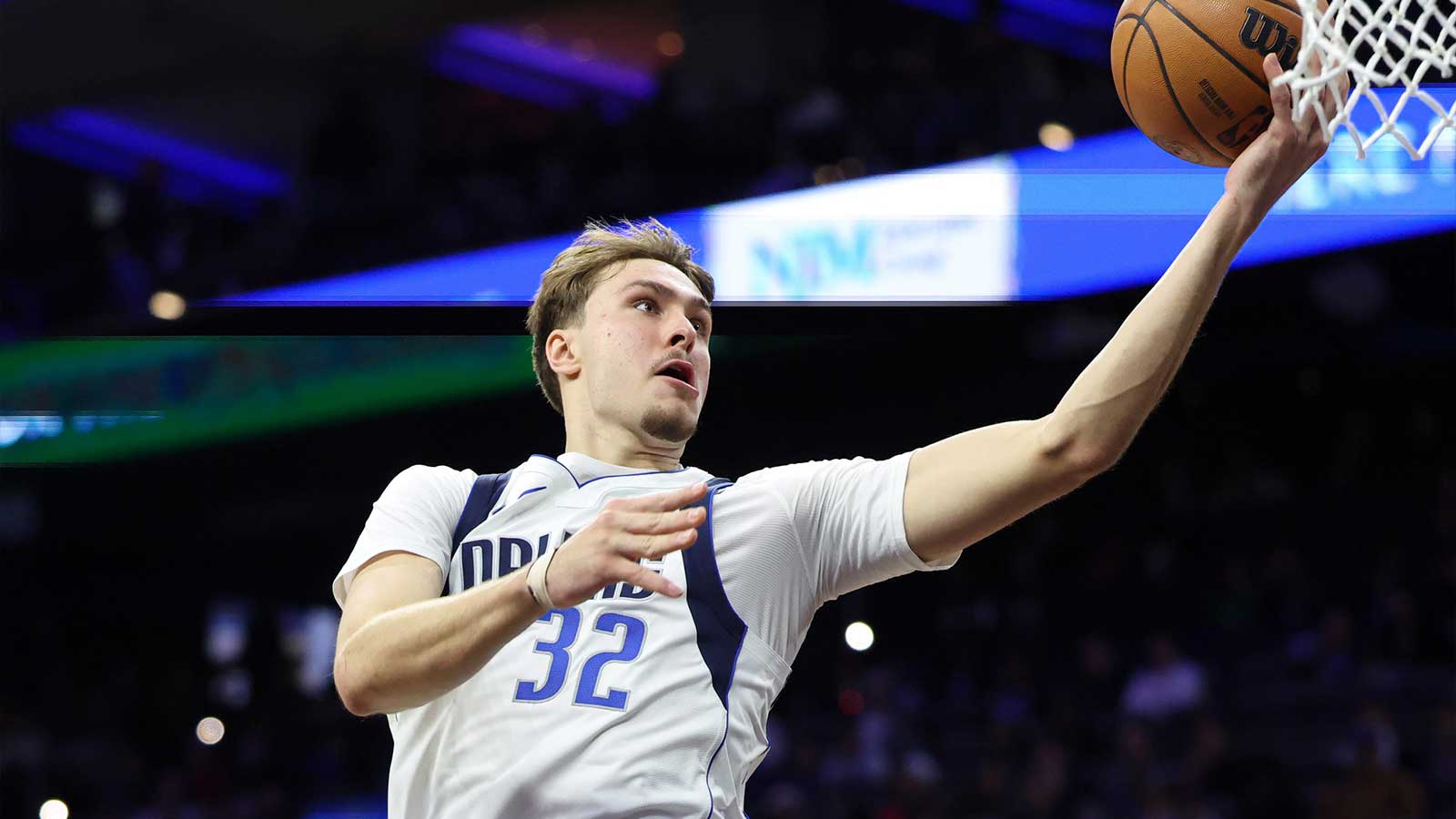 Dallas Mavericks forward Cooper Flagg (32) drives for a score against the Philadelphia 76ers during the second quarter at Xfinity Mobile Arena. 