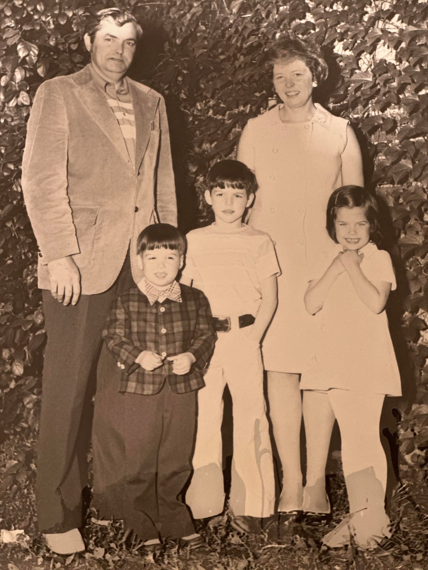 The Chisholm family: Bill is in the center with his father William Sr., mother Judith, brother Tim (left), and sister Robin (right).