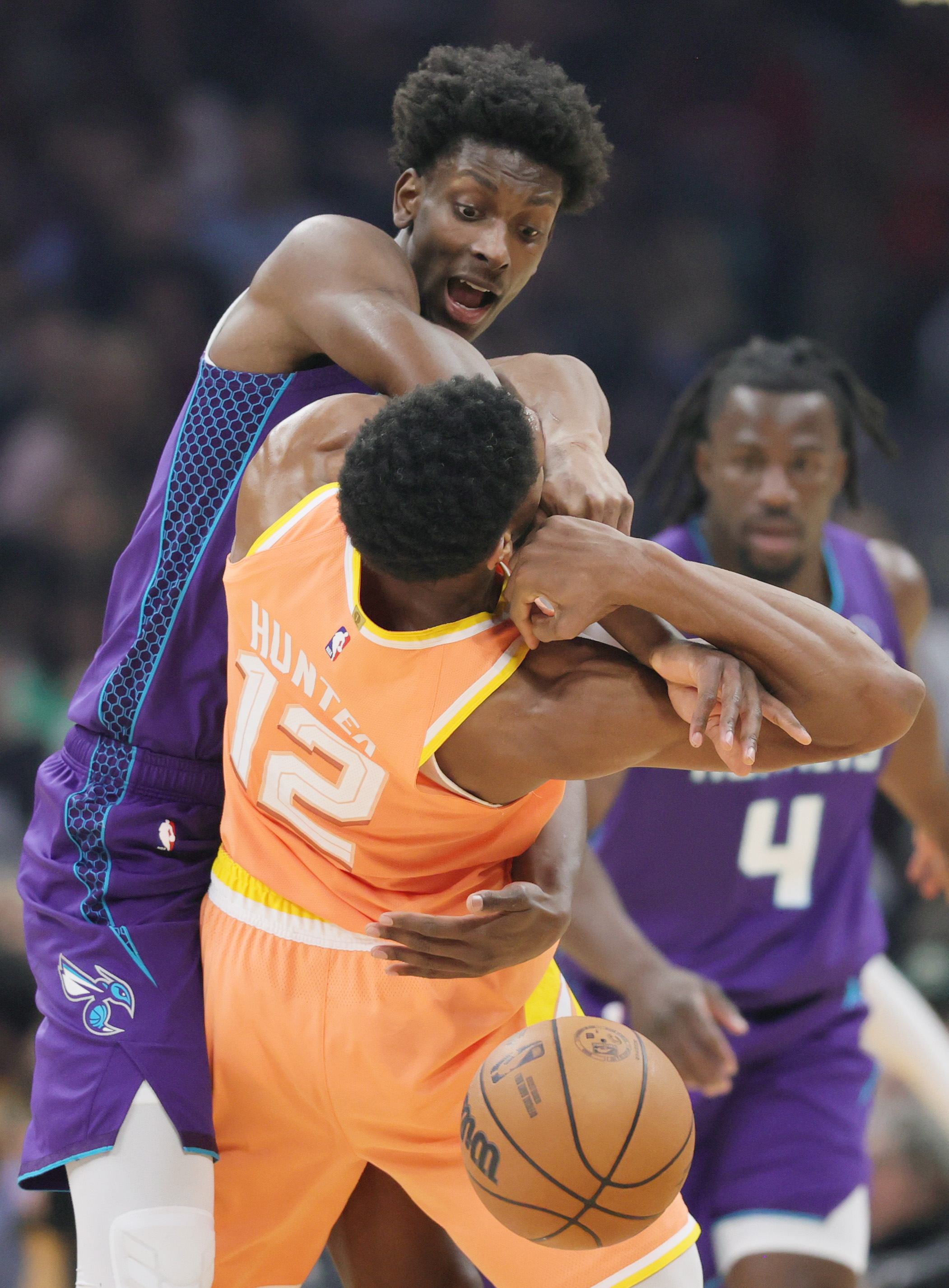 Charlotte Hornets forward Moussa Diabate fouls Cleveland Cavaliers forward De'Andre Hunter going for a steal in the first half at Rocket Arena. 