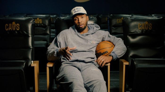 Donovan Mitchell sits in a Cavs chair and talks.