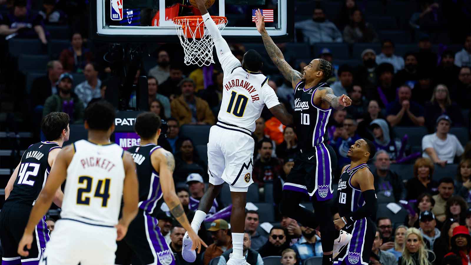 Denver Nuggets guard Tim Hardaway Jr. (10) dunks the ball against Sacramento Kings guard Demar Derozan (10) during the second quarter at Golden 1 Center.