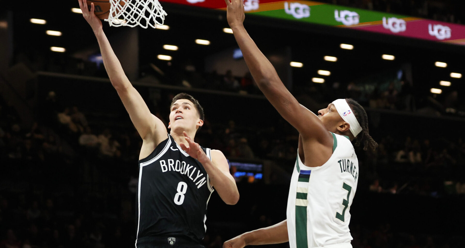 Brooklyn Nets guard Egor Demin (8) goes to the basket past Milwaukee Bucks center Myles Turner (3) during the first half of an NBA basketball game, Sunday, Dec. 14, 2025, in New York. (AP Photo/Heather Khalifa)