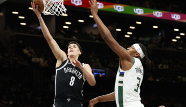 Brooklyn Nets guard Egor Demin (8) goes to the basket past Milwaukee Bucks center Myles Turner (3) during the first half of an NBA basketball game, Sunday, Dec. 14, 2025, in New York. (AP Photo/Heather Khalifa)