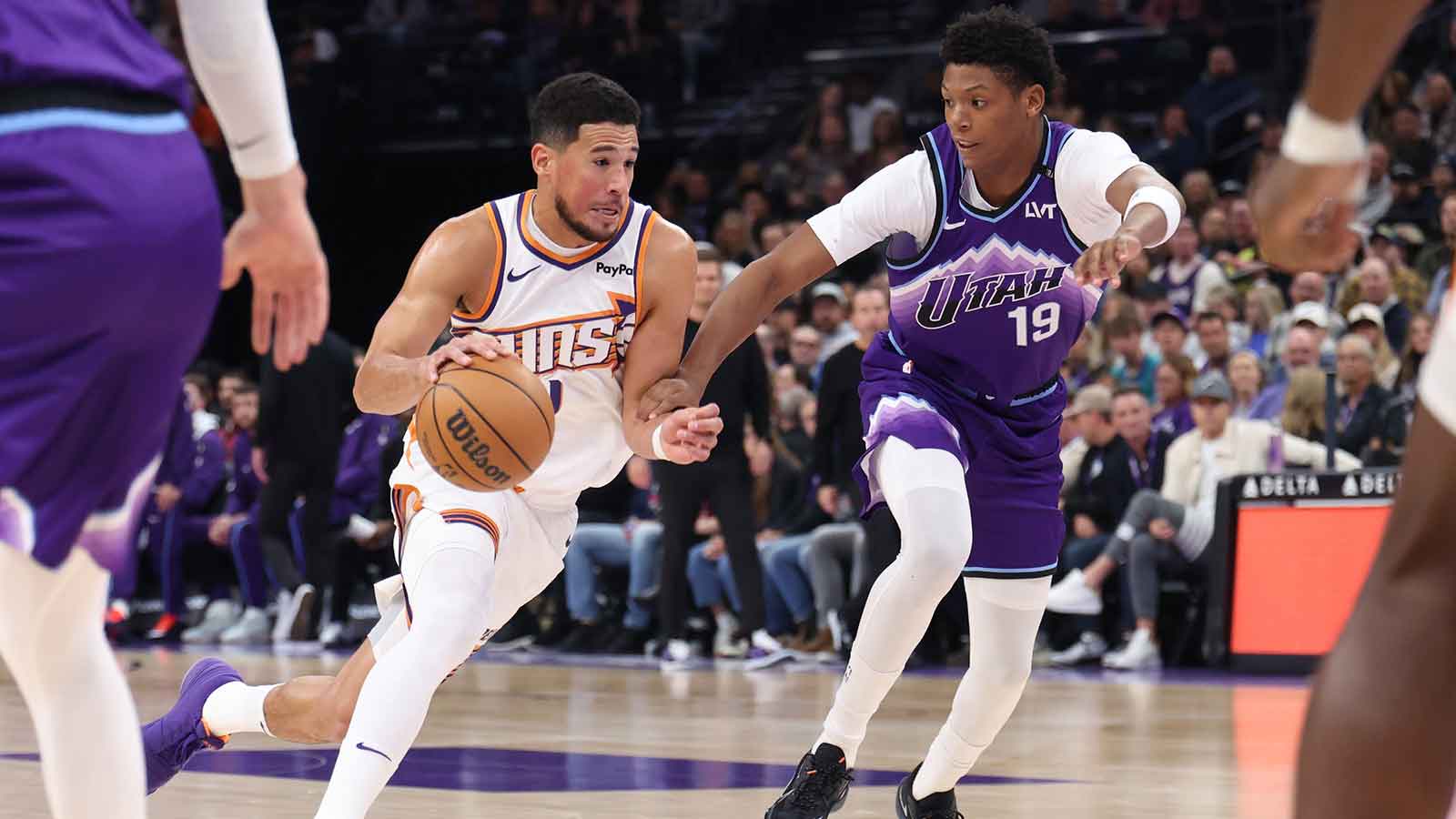 Phoenix Suns guard Devin Booker (1) drives against Utah Jazz guard Ace Bailey (19) during the first quarter at Delta Center. 