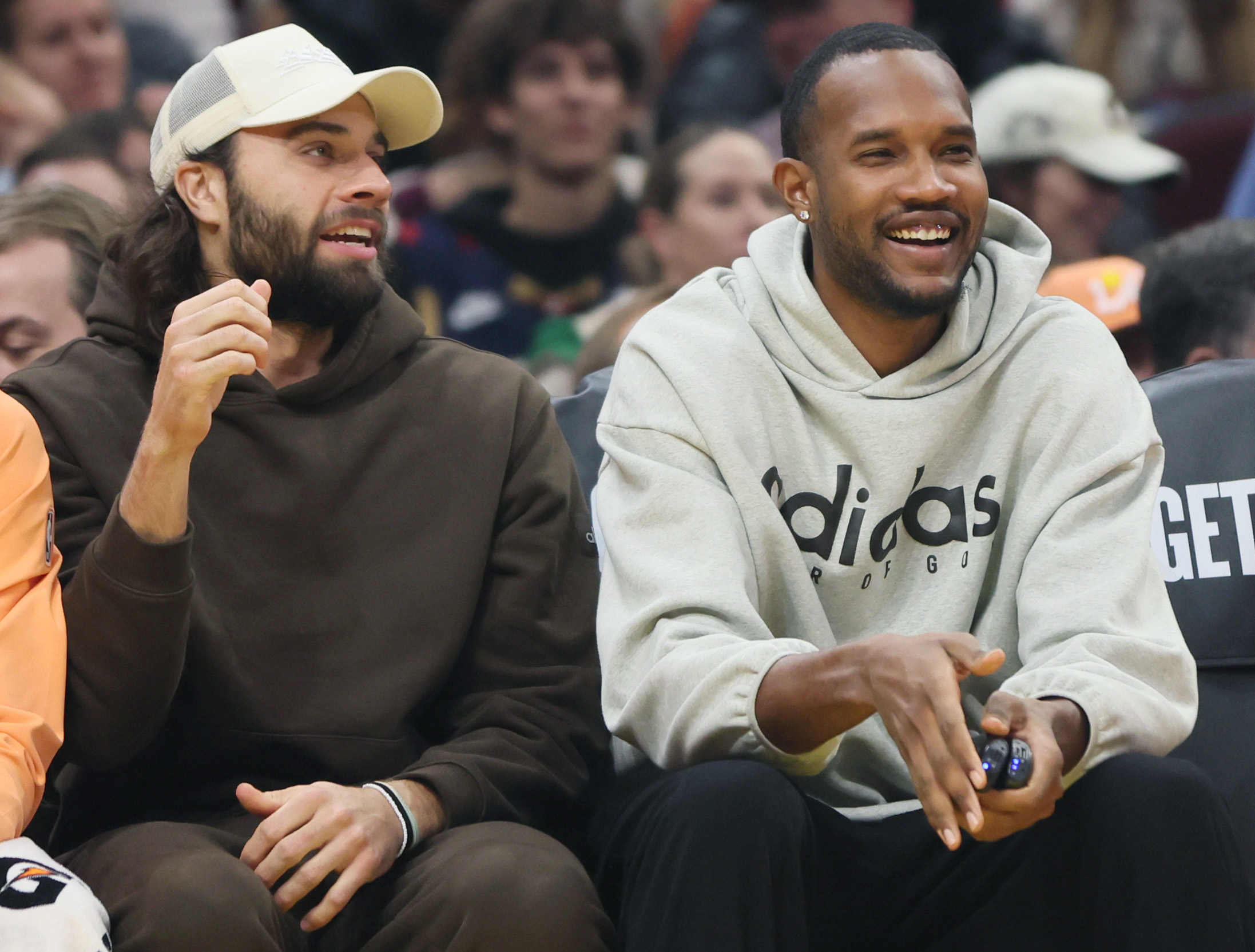 Cleveland Cavaliers guard Max Strus (L) and Cleveland Cavaliers center Evan Mobley watch the action from the bench against the Charlotte Hornets at Rocket Arena. 