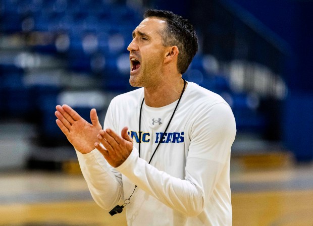 Northern Colorado Bears men's basketball assistant coach and director of performance Brett Cloepfil claps and yells to his players during a practice at Bank of Colorado Arena on the campus of the University of Northern Colorado in Greeley on Friday, Dec. 19, 2025. (Brice Tucker/Staff Photographer)