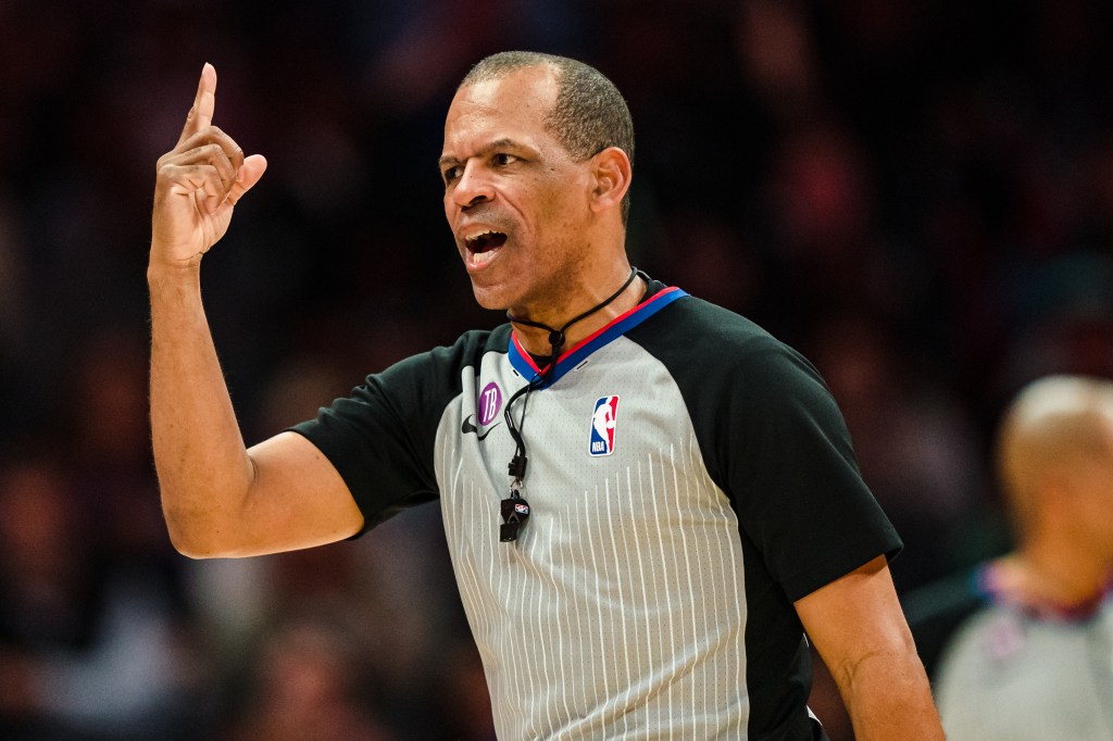 Referee Eric Lewis #42 during the game between the Charlotte Hornets and the Miami Heat at Spectrum Center on February 25, 2023 in Charlotte, North Carolina.