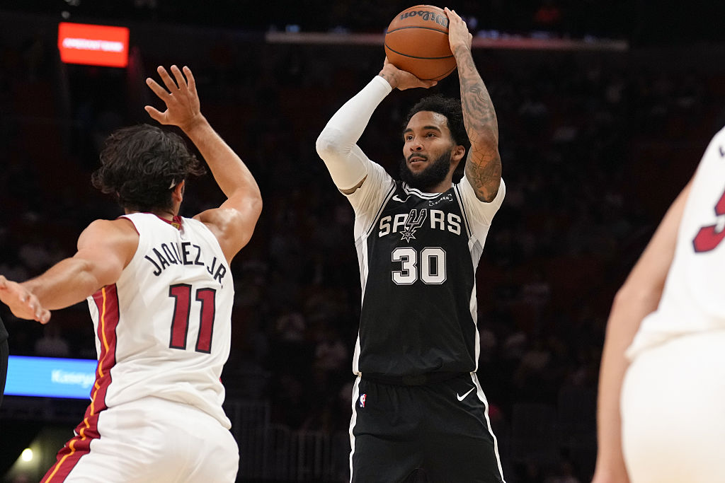MIAMI, FL - OCTOBER 8: Julian Champagnie #30 of the San Antonio Spurs prepares to shoot the ball during the game against the Miami Heat on October 8, 2025 at Kaseya Center in Miami, Florida. NOTE TO USER: User expressly acknowledges and agrees that, by downloading and or using this Photograph, user is consenting to the terms and conditions of the Getty Images License Agreement. Mandatory Copyright Notice: Copyright 2025 NBAE (Photo by Eric Espada/NBAE via Getty Images)