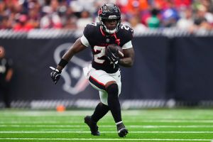 HOUSTON, TX - NOVEMBER 02: Woody Marks #27 of the Houston Texans carries the ball against the Denver Broncos during the second half of an NFL football game at NRG Stadium on November 2, 2025 in Houston, Texas. (Photo by Cooper Neill/Getty Images)