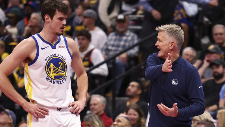 DENVER, COLORADO - NOVEMBER 07: Steve Kerr of the Golden State Warriors talks with Quinten Post #21 during a break in the game against the Denver Nuggets in the third quarter at Ball Arena on November 7, 2025 in Denver, Colorado. NOTE TO USER: User expressly acknowledges and agrees that, by downloading and or using this photograph, User is consenting to the terms and conditions of the Getty Images License Agreement. (Photo by Justin Tafoya/Getty Images)