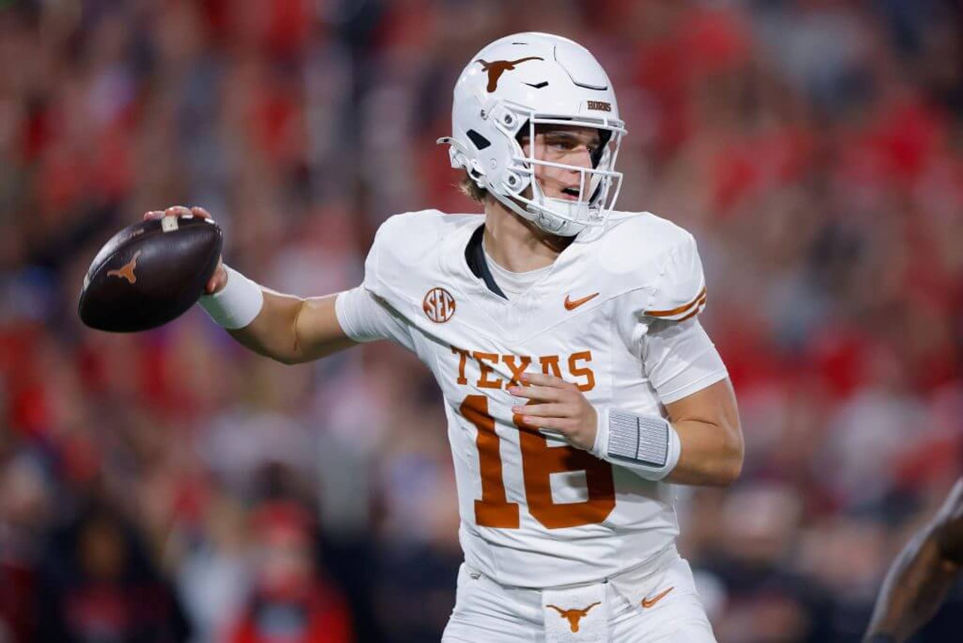 Texas quarterback Arch Manning prepares to throw a pass during a game against Georgia.