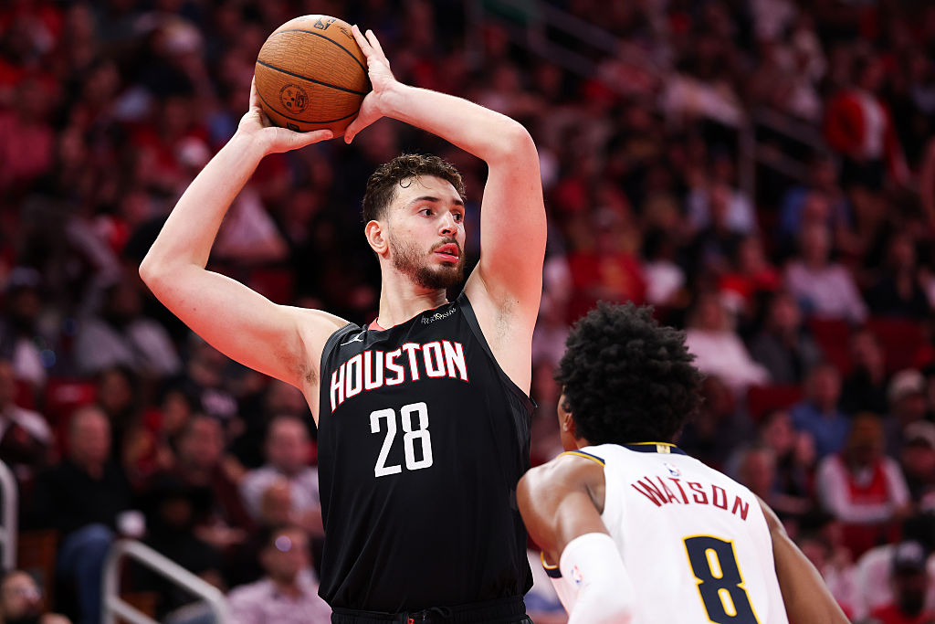 HOUSTON, TEXAS - NOVEMBER 21: Alperen Sengun #28 of the Houston Rockets looks to pass during the second half of the game against Peyton Watson #8 of the Denver Nuggets at Toyota Center on November 21, 2025 in Houston, Texas. (Photo by Kenneth Richmond/Getty Images)