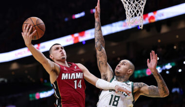 MIAMI, FLORIDA - NOVEMBER 26: Tyler Herro #14 of the Miami Heat drives to the net around Kyle Kuzma #18 of the Milwaukee Bucks during the first half at Kaseya Center on November 26, 2025 in Miami, Florida. NOTE TO USER: User expressly acknowledges and agrees that, by downloading and or using this photograph, User is consenting to the terms and conditions of the Getty Images License Agreement. (Photo by Carmen Mandato/Getty Images)