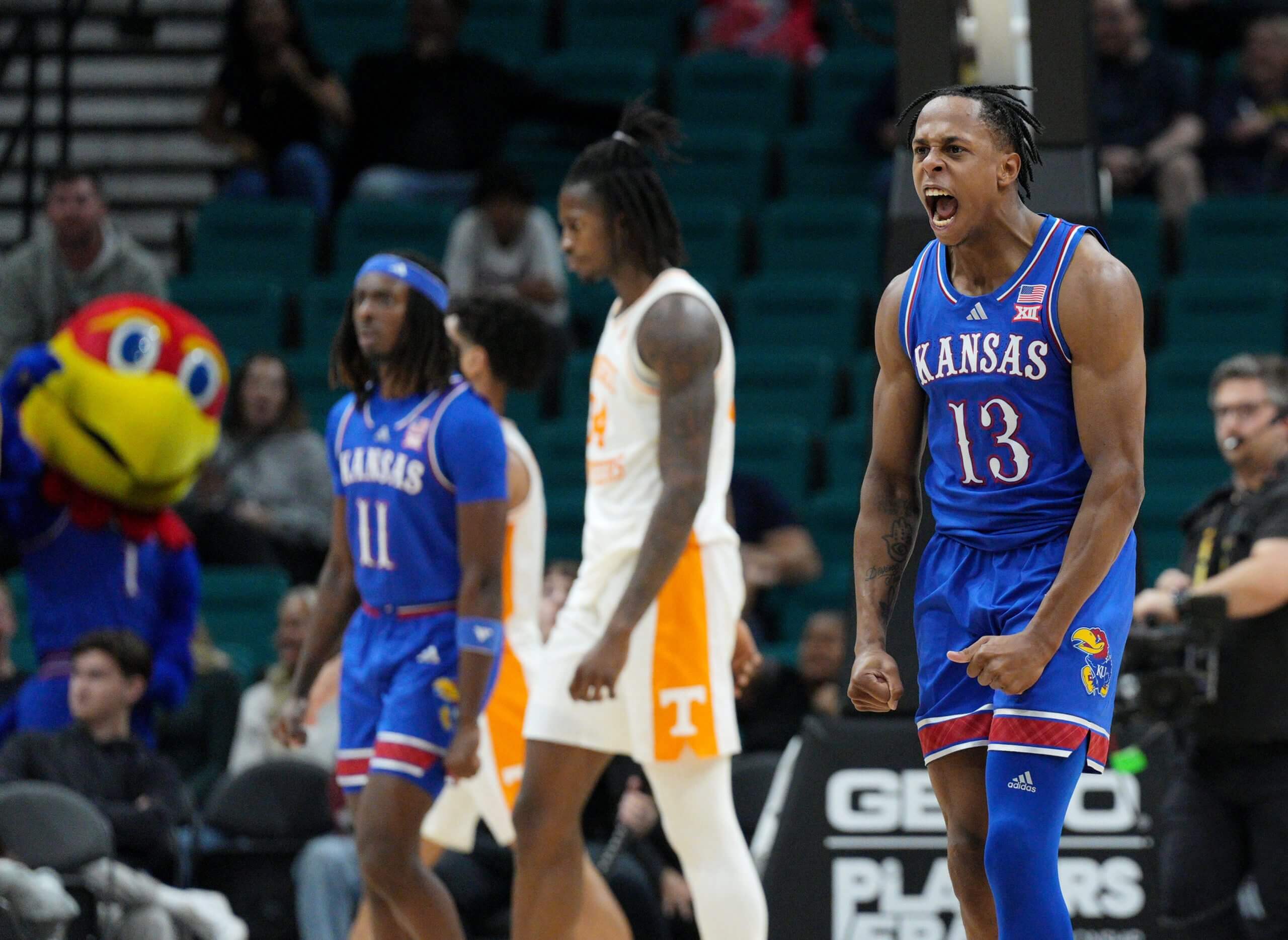 Kansas's Elmarko Jackson celebrates before a timeout.