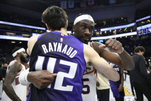 SACRAMENTO, CALIFORNIA - NOVEMBER 26: Maxime Raynaud #42 of the Sacramento Kings hugs Mark Williams #15 of the Phoenix Suns after an NBA Cup game at Golden 1 Center on November 26, 2025 in Sacramento, California. NOTE TO USER: User expressly acknowledges and agrees that, by downloading and or using this photograph, User is consenting to the terms and conditions of the Getty Images License Agreement. (Photo by Eakin Howard/Getty Images)