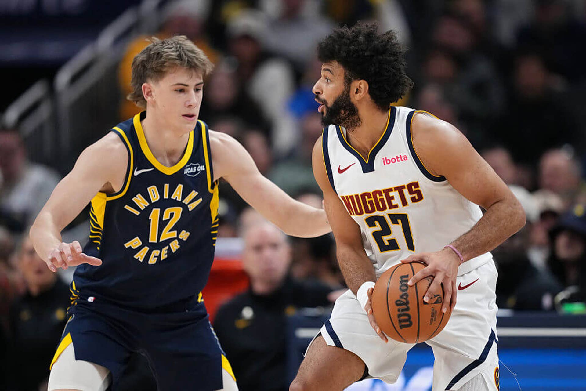 Jamal Murray looks to get past Johnny Furphy during a Nuggets-Pacers matchup.