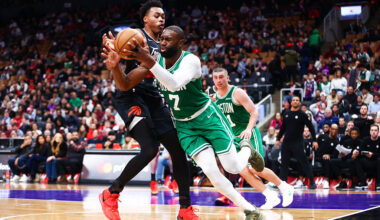 TORONTO, CANADA - DECEMBER 07: Jaylen Brown #7 of the Boston Celtics tries to play the ball as he's defended by Scottie Barnes #4 of the Toronto Raptors during the second half of their NBA game at Scotiabank Arena on December 7, 2025 in Toronto, Ontario, Canada. NOTE TO USER: User expressly acknowledges and agrees that, by downloading and/or using this Photograph, user is consenting to the terms and conditions of the Getty Images License Agreement (Photo by Cole Burston/Getty Images)