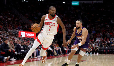 Kevin Durant #7 of the Houston Rockets drives to the basket against Dillon Brooks #3 of the Phoenix...